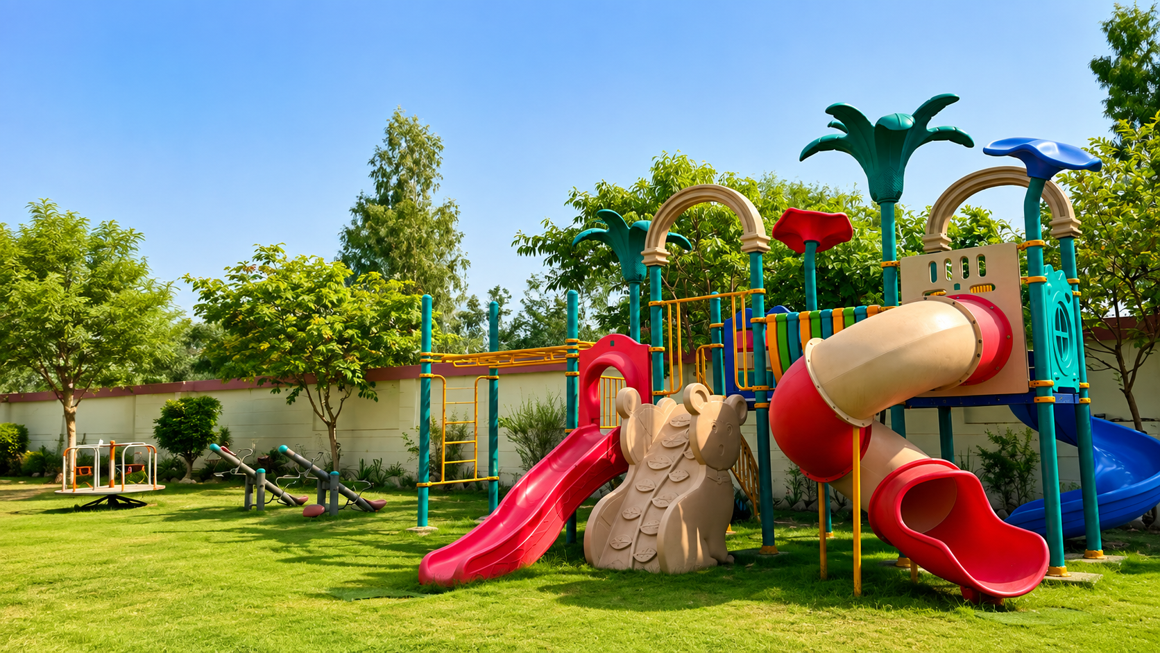 Colourful playground equipment on the lawn for early years students — Ayodhya Road campus, VEDAM World School