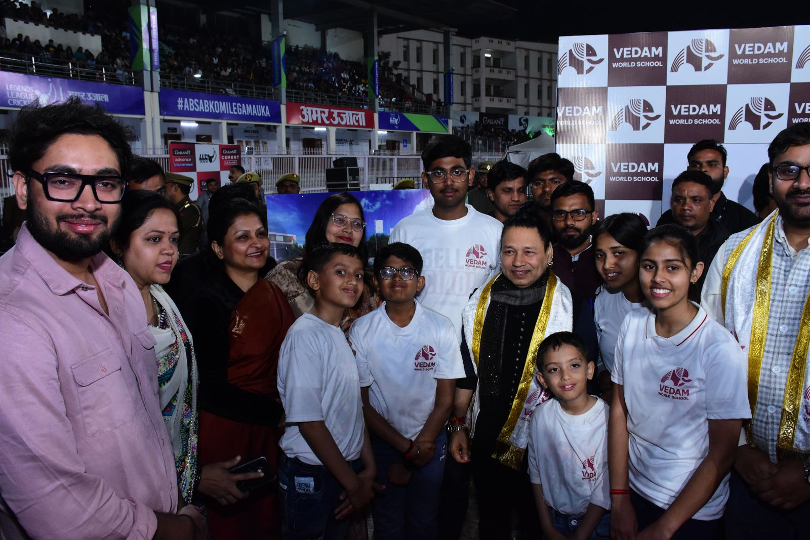 Kailash Kher with Vedam families and students at the Vedam backdrop