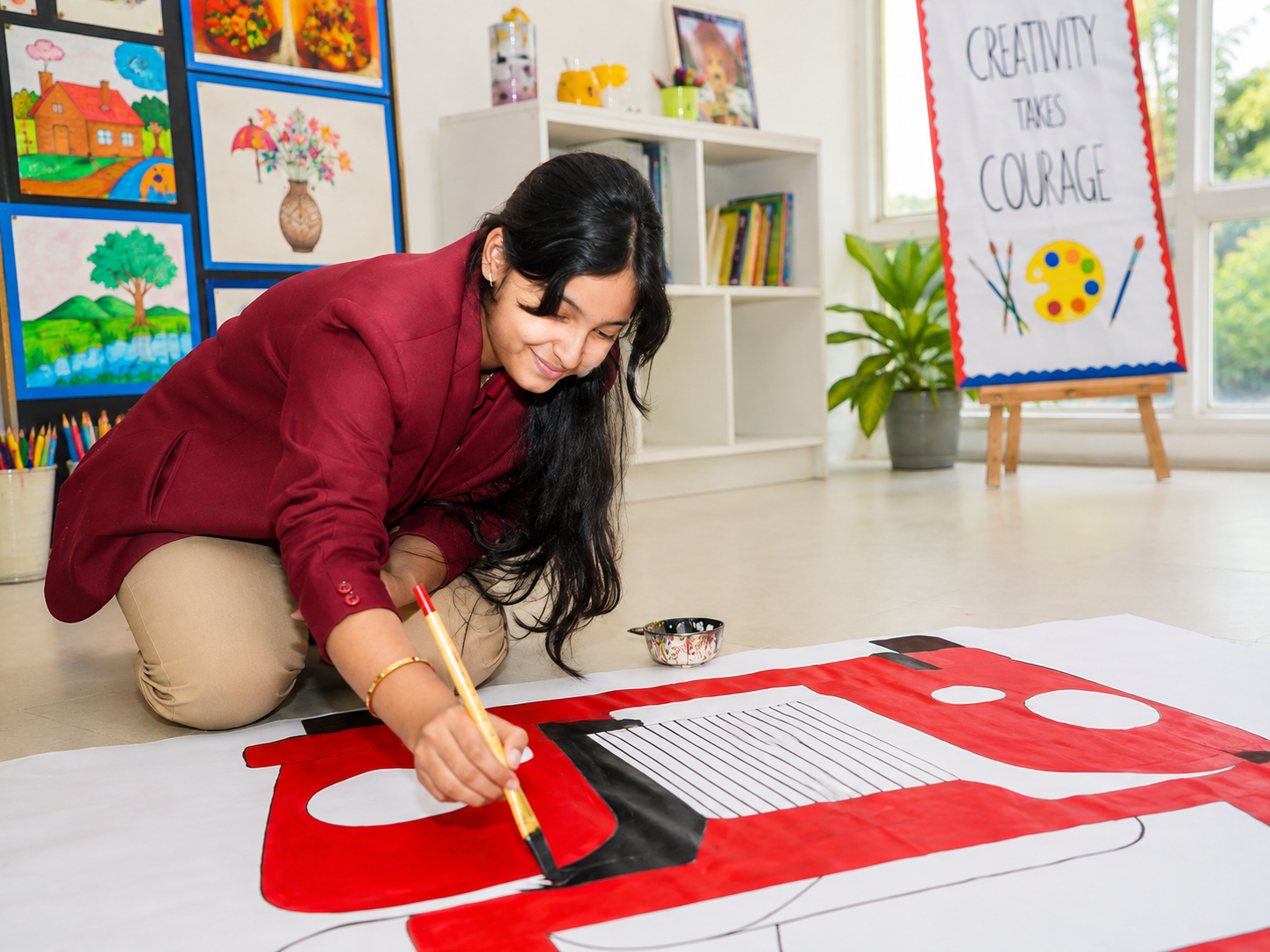 Student painting a large backdrop in the art studio — Ayodhya Road campus, VEDAM World School