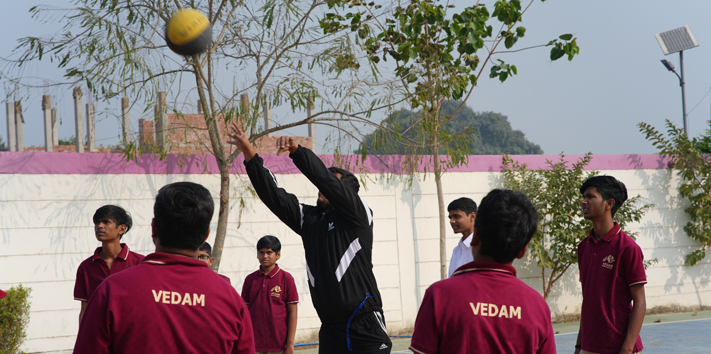 Students playing volleyball on campus — VEDAM World School