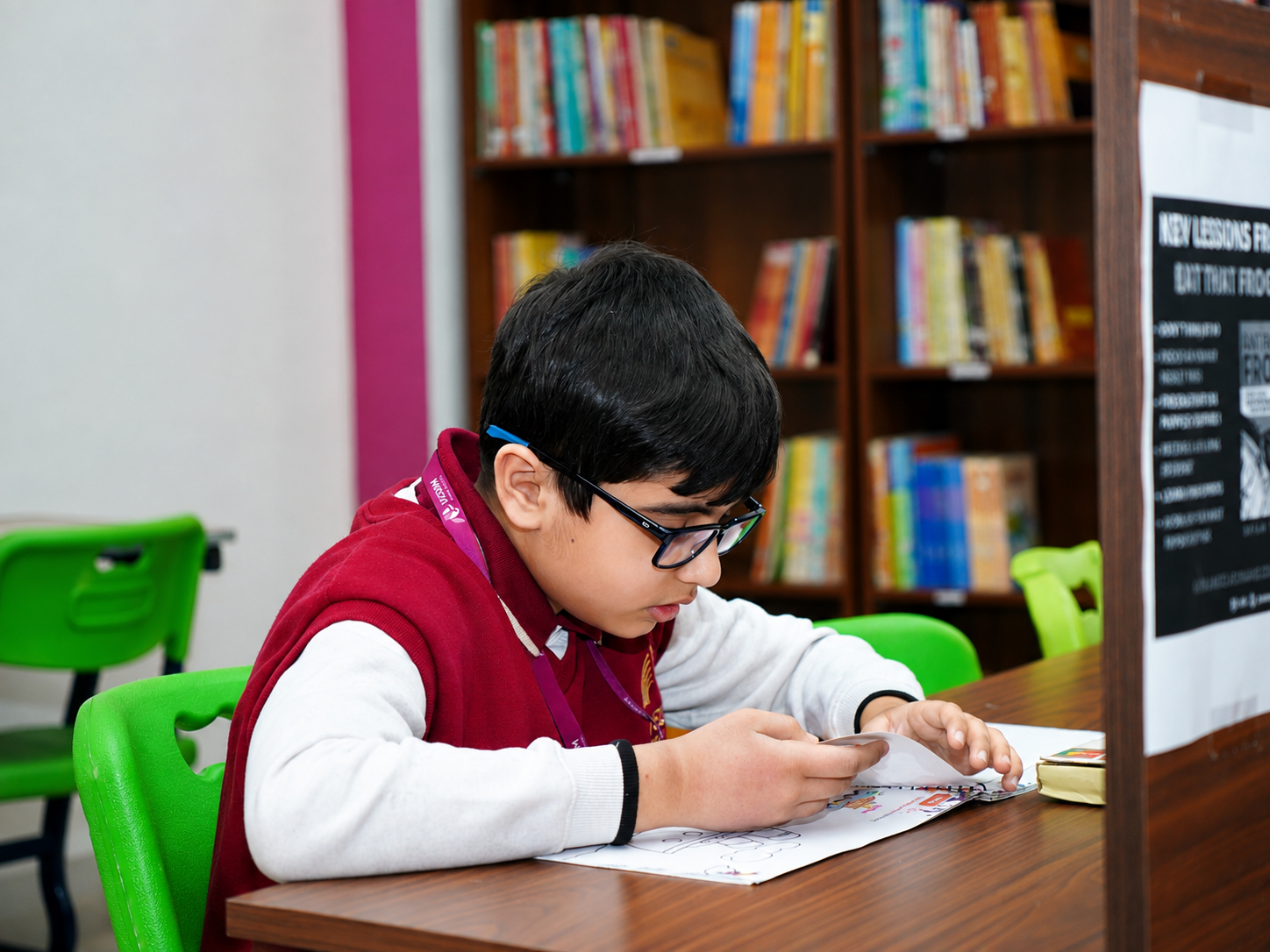 Student reading at a library table — Ayodhya Road campus, VEDAM World School
