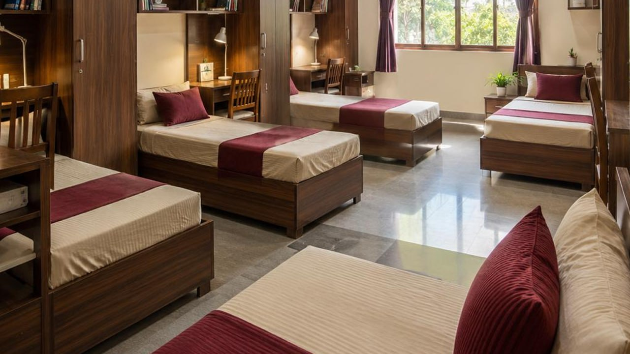 Boarding dormitory with student beds — VEDAM World School